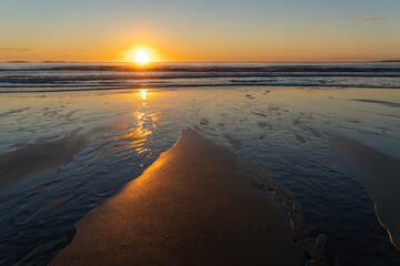 Wall Mural - Sunrise on the Old Orchard Beach in Maine during Autumn.