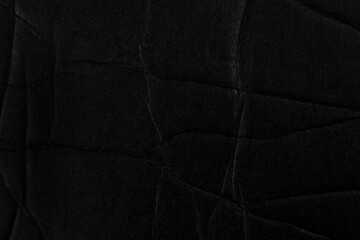 Wall Mural - Black fractured crumpled paper surface. Broken cardboard
