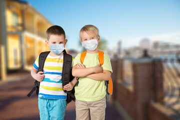 Poster - School child wearing face mask during corona virus outbreak.