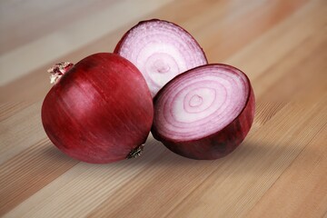 Canvas Print - Red whole and sliced onion on the desk