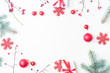 © maria_lh - Flat lay christmas frame with red berries, fir branches, snowflakes, red balls and gift box on a white background. Merry christmas card and copy space for your text