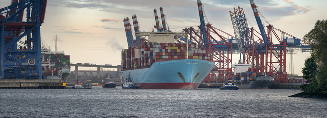 Wall Mural - Large container ship departs from the port of Hamburg 