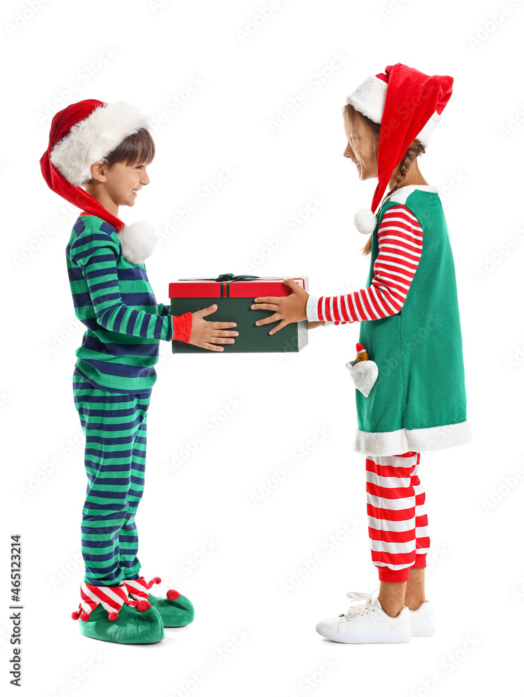 Cute little children dressed as elves with Christmas gift on white background