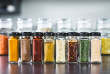 Spices And Grains In Matching Spice Jars On Kitchen Counter, Simple Vegan Ingredients And Seasonings