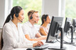 © Acronym - Diverse team of young professionals is working in the phone support office. Working day of sales managers in the call center. Business, telephone consulting and problem solving.