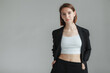 © splitov27 - Fashion shot of stylish vogue woman in black suit in studio