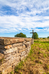 Sticker - Church wall with a wooden cross on a meadow