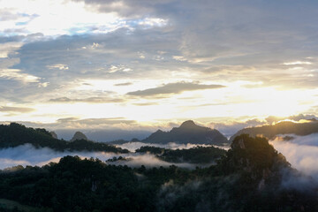 Wall Mural - Beautiful mountain sunrise with sunlight and fog over northern Thailand's mountains