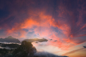 Sticker - Beautiful mountain sunrise with sunlight and fog over northern Thailand's mountains