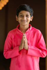 Poster - Cute indian little boy praying and celebrating diwali festival.