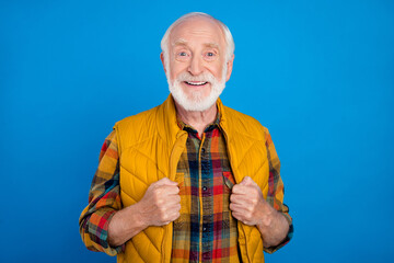 Sticker - Portrait of attractive cheerful grey-haired man wearing cosy seasonal clothes isolated over bright blue color background