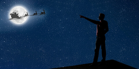 dad is on the roof at night and look at the christmas night sky