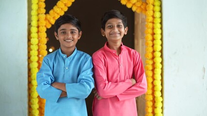 Wall Mural - Indian little boy in traditional wear and celebrating diwali festival.