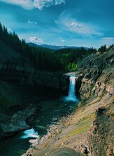 Scenic View Of Waterfall Against Sky In Ya Ha Tinda Alberta