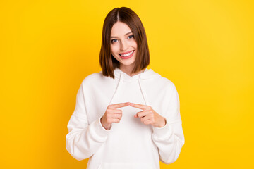 Wall Mural - Portrait of attractive cheerful shy girl coquettish mood isolated over bright yellow color background