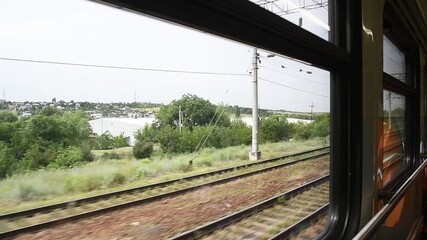 Wall Mural - View from the railway car to the landscape passing outside the train window