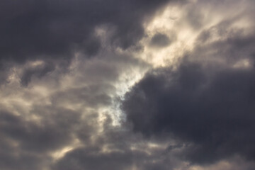 Wall Mural - storm cloud with bright skylights of sunlight