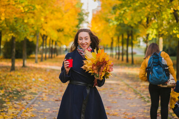 Beautiful glamorous girl portrait in autumn park