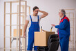 © Elnur - Two male professional movers doing home relocation