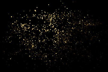 Wall Mural - golden blurred bokeh lights on black background. glitter sparkle stars for celebrate. overlay for yo