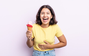 Wall Mural - pretty young woman laughing out loud at some hilarious joke. ice cream concept