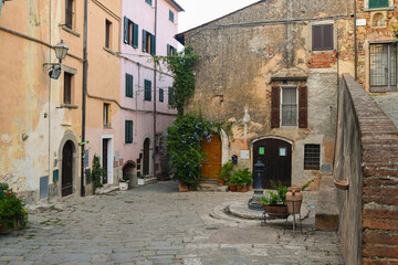 Sticker - Glimpse of the medieval village in the Tuscan Maremma area with ancient buildings in summer, Castagneto Carducci, Livorno, Tuscany, Italy