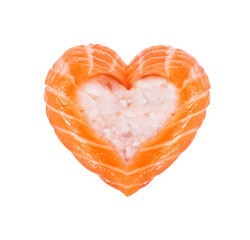 Wall Mural - Sushi roll with salmon in the shape of a heart close-up