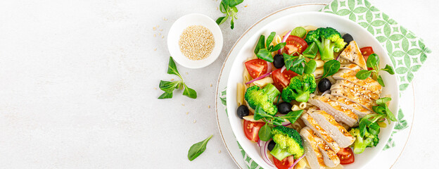 Sticker - Pasta salad bowl with broccoli, tomato, onion, olives, corn salad and grilled chicken breast for lunch. Healthy dietary food. Top view. Banner.