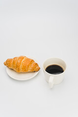 Sticker - sweet and tasty croissant and black coffee cup on white with space for text