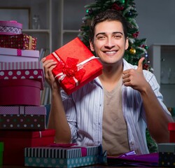 Wall Mural - Man with many christmas gifts in boxes