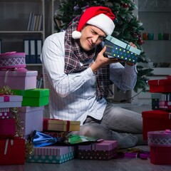 Canvas Print - Man with many christmas gifts in boxes