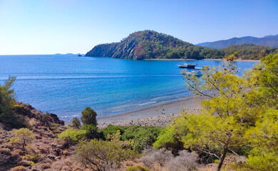 Wall Mural - View of the stone beach at the site of the ancient Lycian city of Phaselis. Historic site