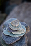 Fototapeta Kwiaty - Stone Heart On Pebble Stack