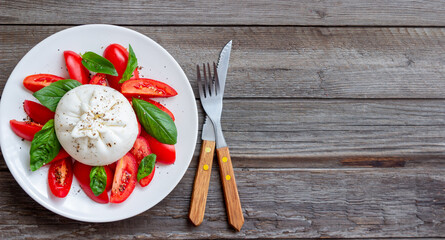 Wall Mural - Italian burrata cheese with tomatoes and basil. Salad. Healthy eating. Vegetarian food.