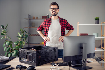 Wall Mural - Portrait of attractive cheerful skilled trendy guy improving motherboard detail pc at studio office workplace workstation indoor