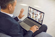 Businessman use laptop talk speak on video call with diverse business partners or clients. Man employee have webcam online virtual event or conference on computer. Distant work, technology concept.
