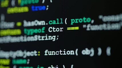 Close up of monitor screen with developing programming and coding technologies. Programmer or hacker is typing code on keyboard. Concept of bitcoin btc mining and development in virtual cyber space