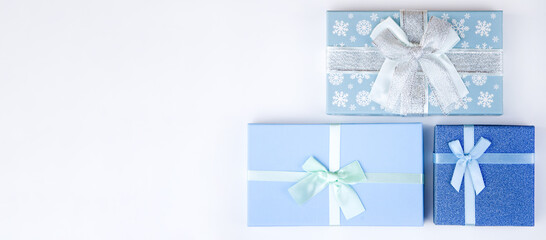 blue boxes with christmas gifts on a white background. christmas sale,holiday discounts,new year bac