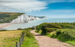 Seven Sisters, East Sussex, England. The rugged Sussex coastline looking over Cuckmere Haven and the white chalk cliffs into the English Channel.