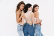 © Drobot Dean - Young three women wearing bra hugging and posing on camera