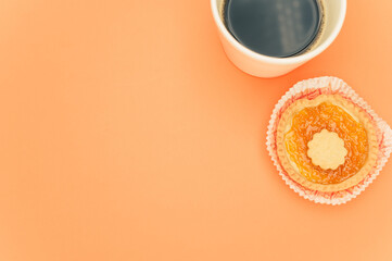 Sticker - delicious apricot and cherry jam pastry in a paper backing cup and black coffee cup on orange