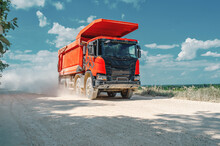 Industrial Dump Red Truck, Transportation Of Stones, Rides On A Dusty Road. Career Work