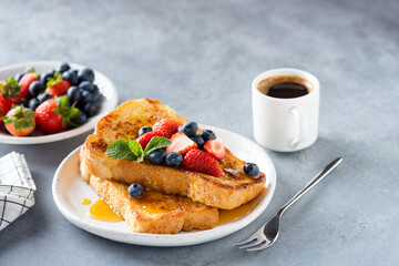 Wall Mural - Sweet french challah toast with berries and syrup served on plate. Copy space for text or design elements