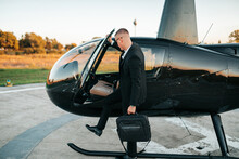 Wealthy Young Businessman Is Preparing To Use His Own Private Chopper Or Helicopter To Travel To A Business Meeting.