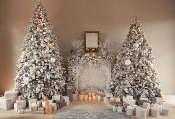 hall room interior with a fireplace with candles and two decorated christmas trees with gifts. large