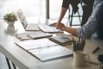 Business People Talking Discussing with coworker planning analyzing financial document data charts and graphs in Meeting and successful teamwork Concept