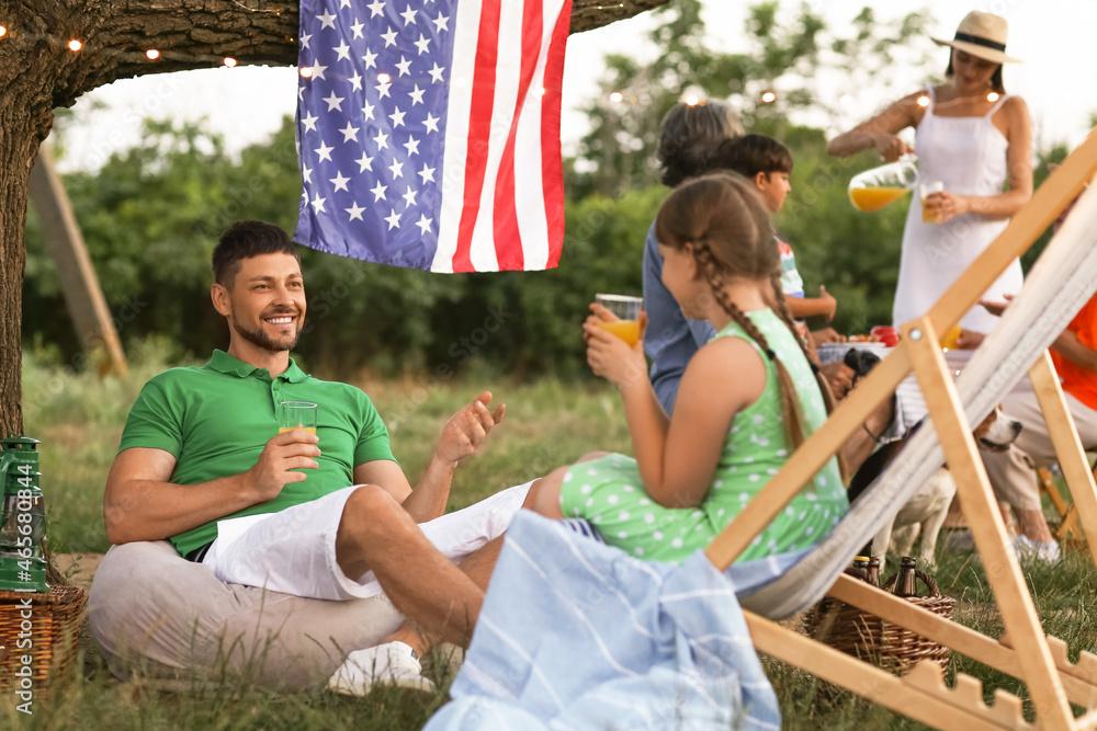 Happy family at picnic on summer day