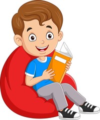 Sticker - Little boy reading a book and sitting on big pillow