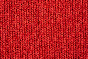 Red knitted wool texture background