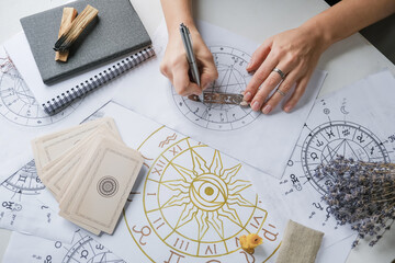 astrology. astrologer calculates natal chart and makes a forecast of fate.tarot cards, fortune telli